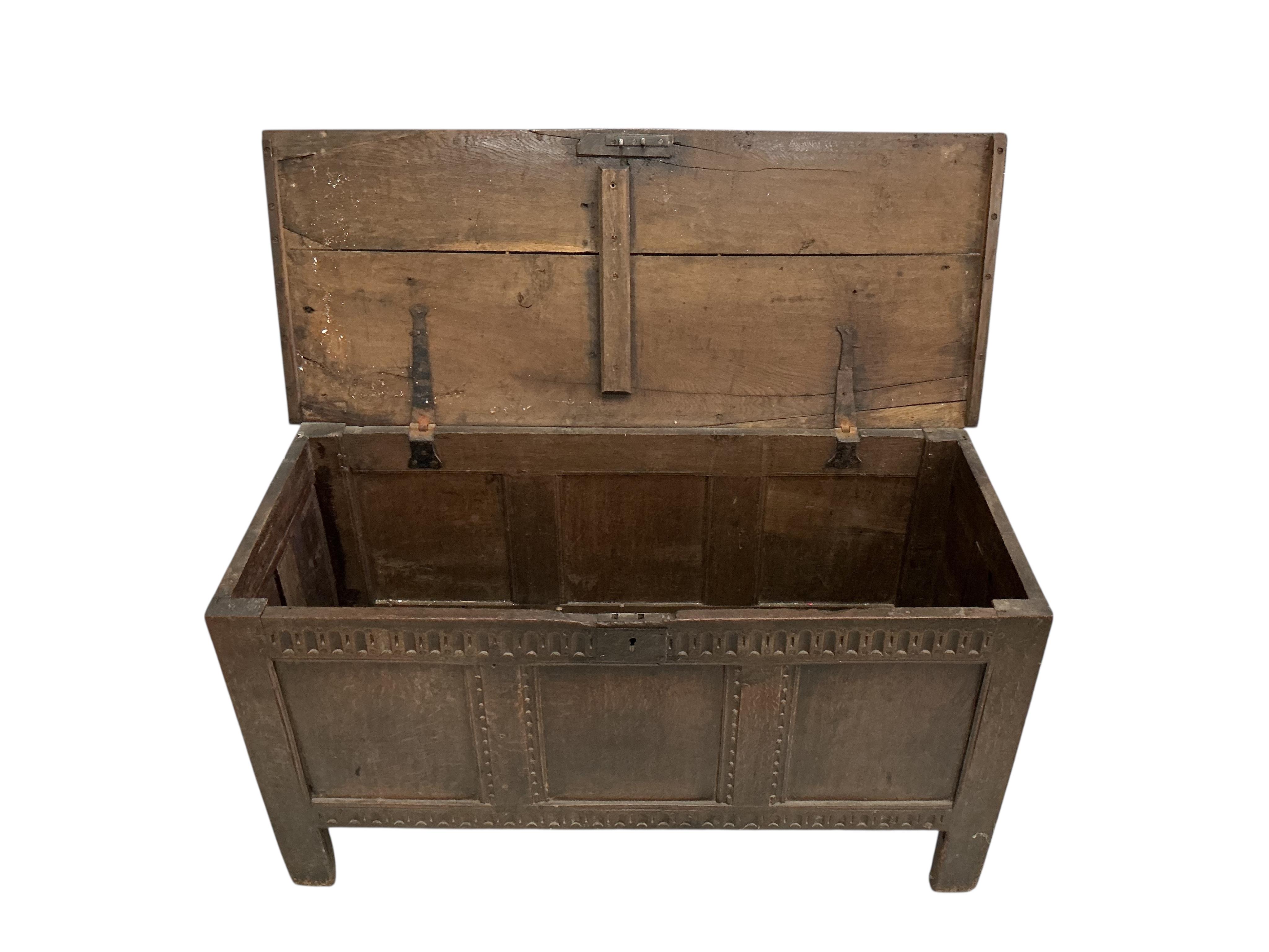 An 18th century oak coffer, width 122cm, depth 49cm, height 63cm
